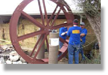 Extreme Home Makeover Installation of a waterwheel